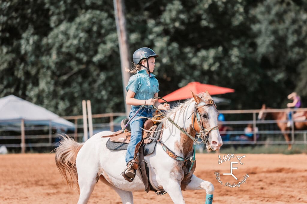 little girl on paint horse