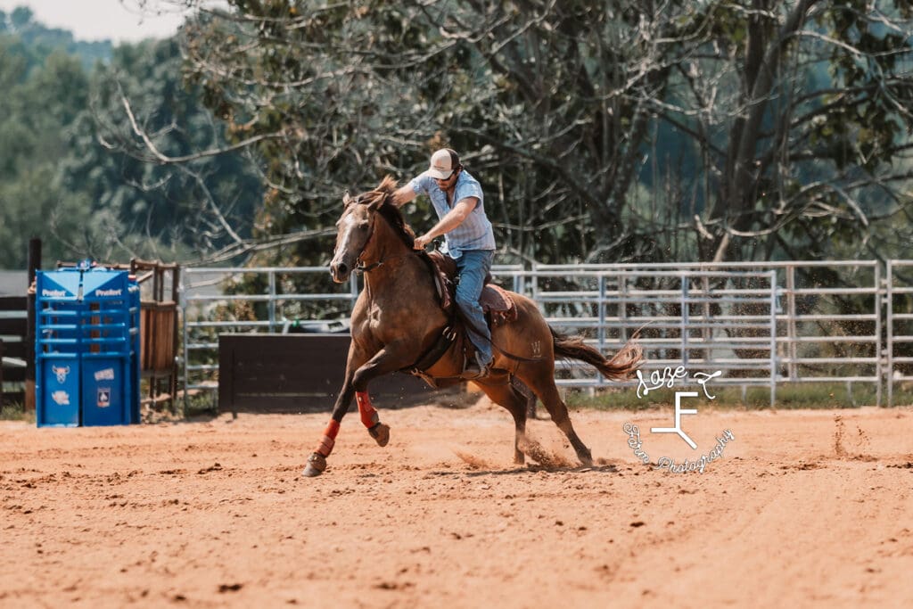 guy running brown horse