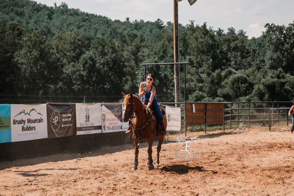 Breakaway roper in blue tank top after run