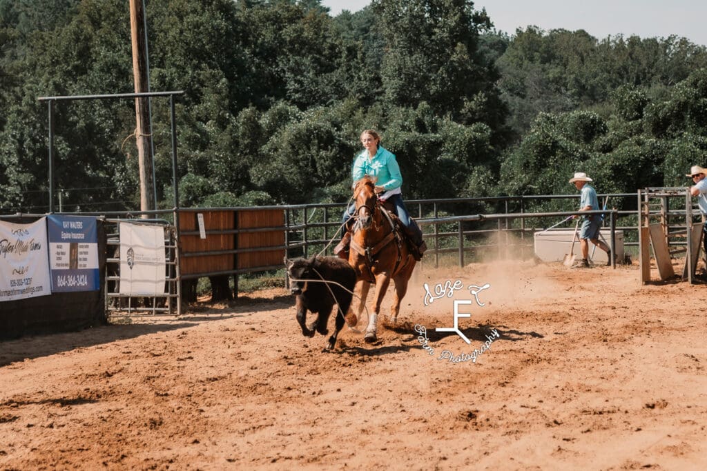 Break away roper in light blue shirt