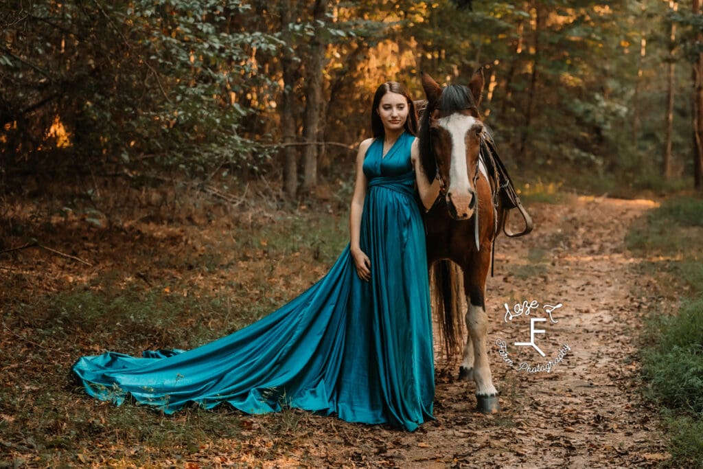 Natalie & paint pony in the woods