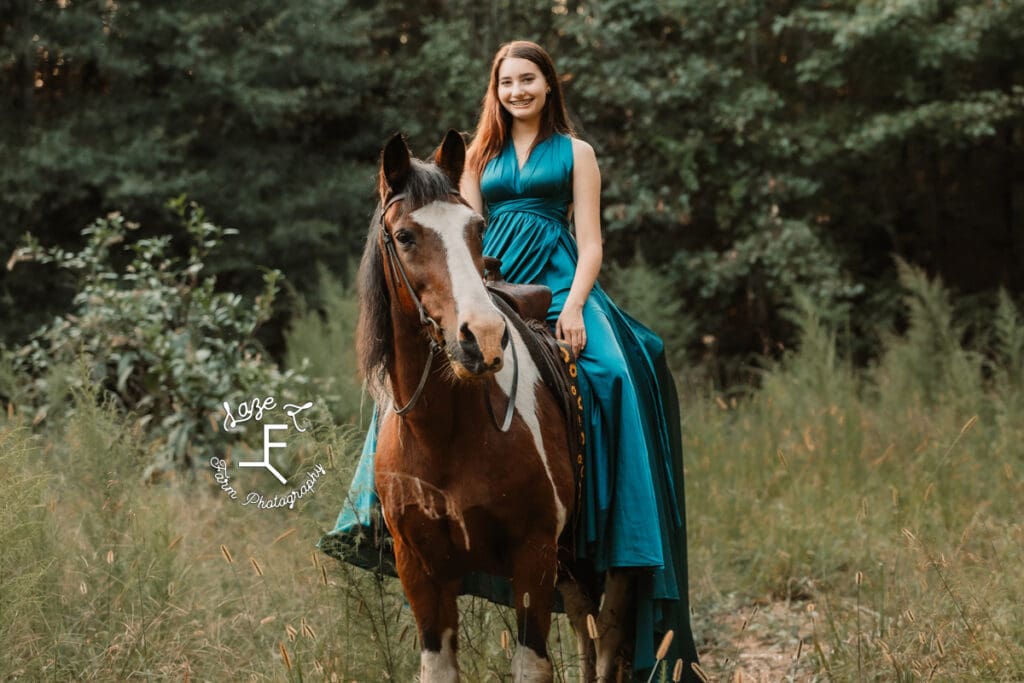 Natalie riding paint pony