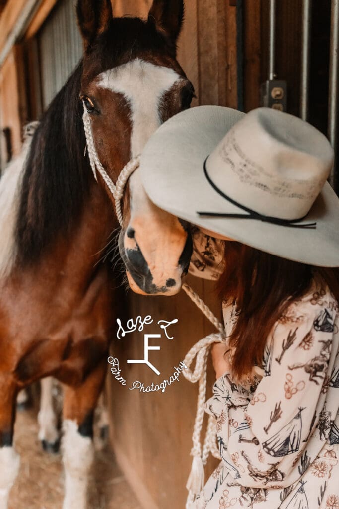 Natalie kissing paint pony