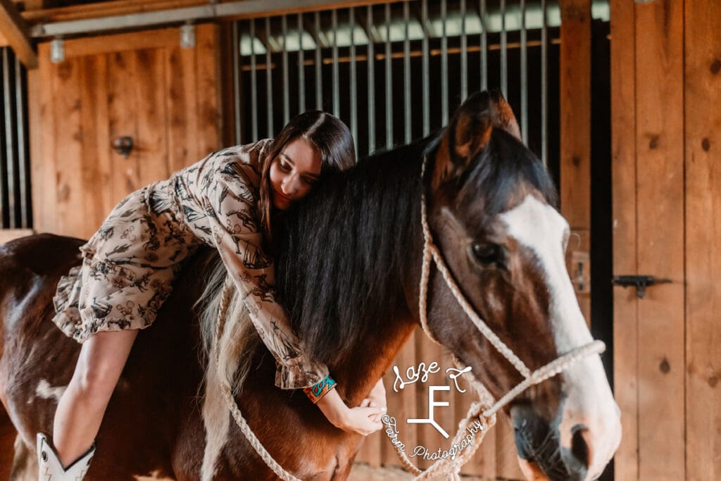 Natalie sitting on paint pony