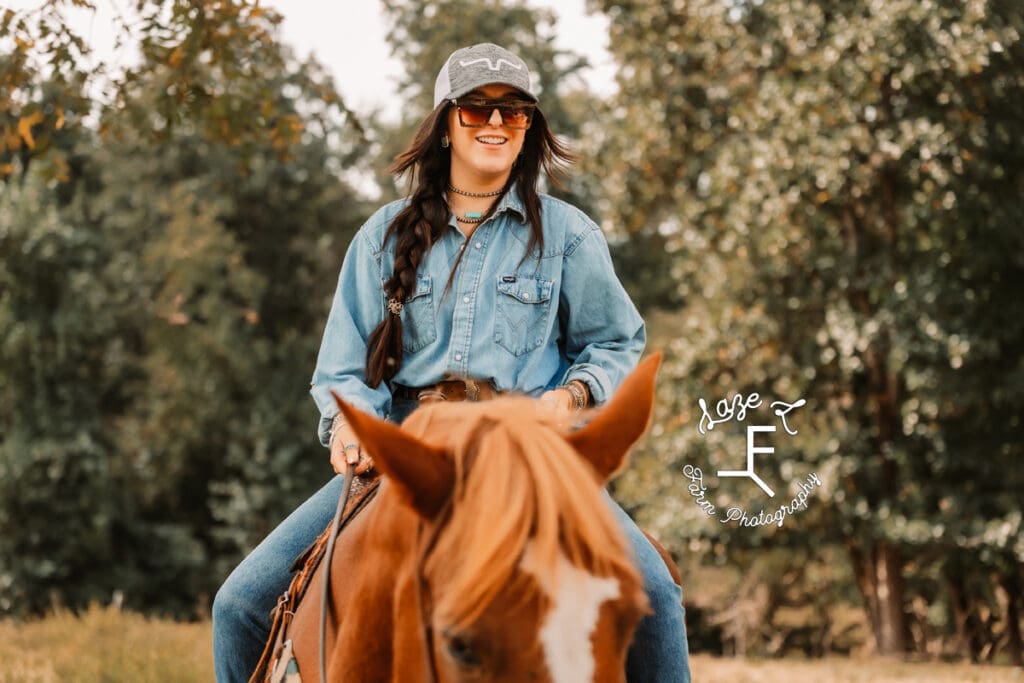 Halle riding Gus smiling