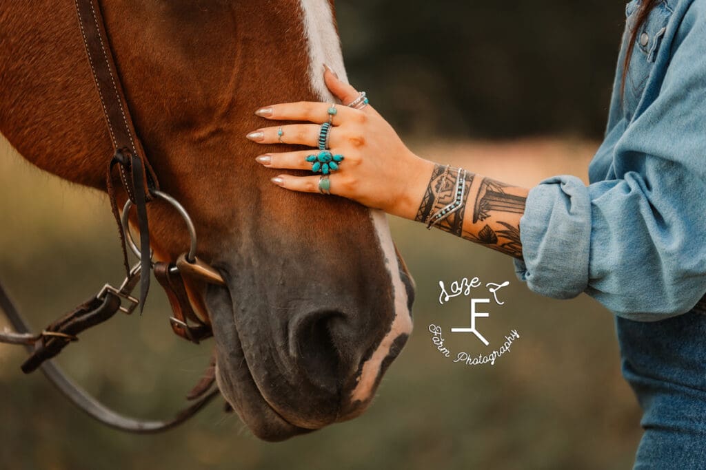 Halle petting Gus showing turquoise jewelry