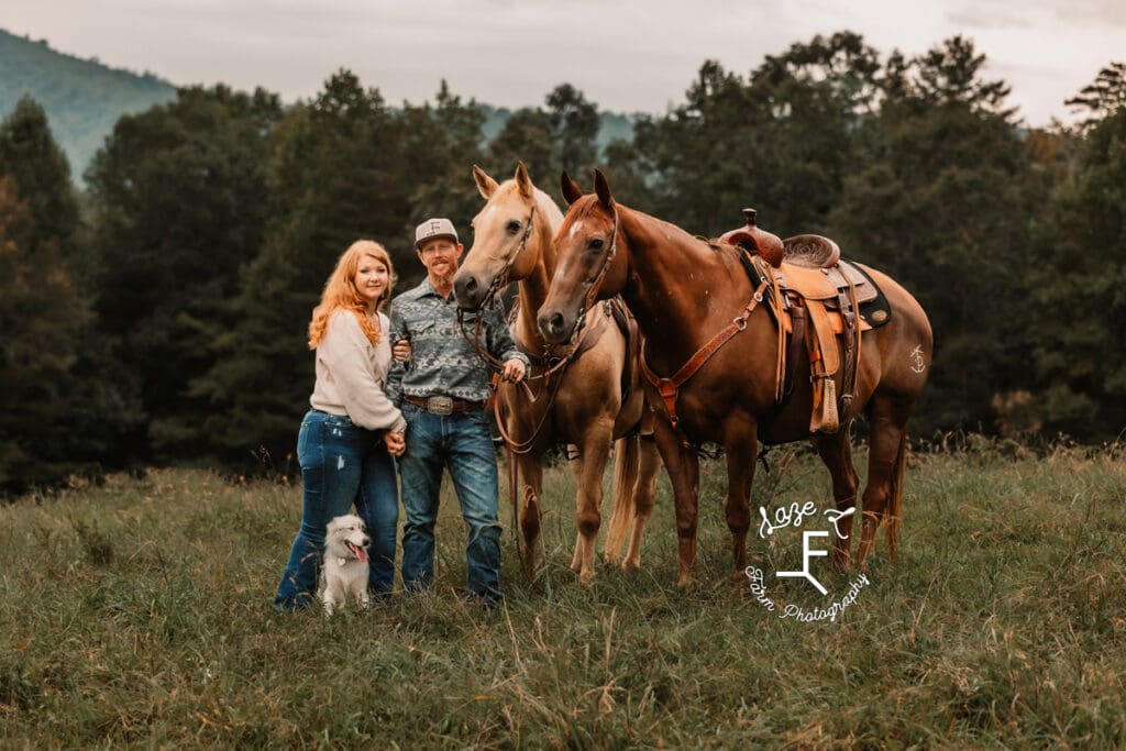 Taylor and Kyle standing with their horses and dog