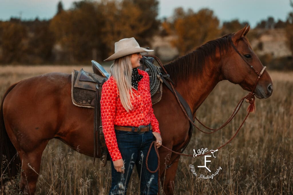 Cowgirl 1 standing with brown horse