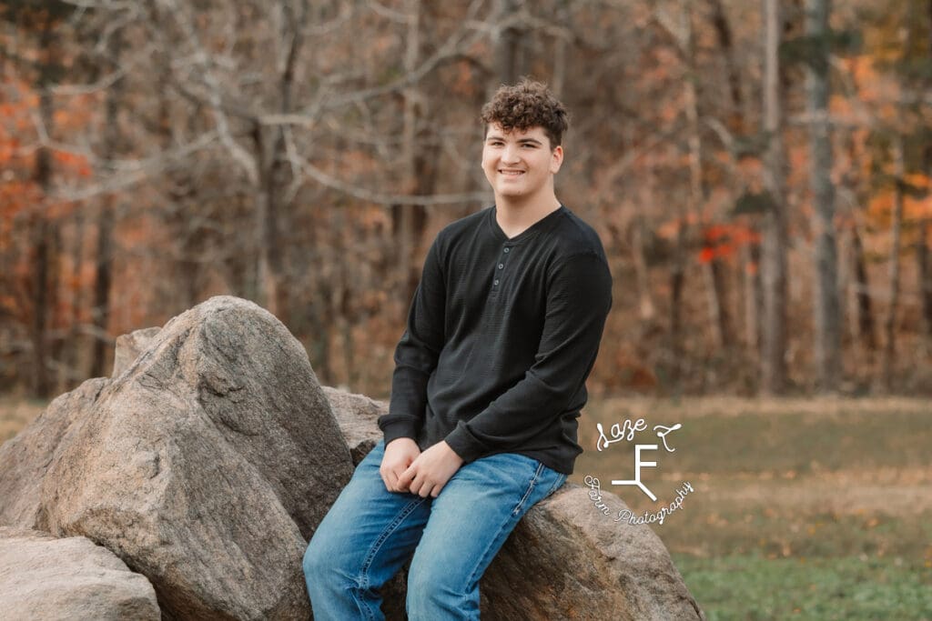 Big brother sitting on rocks