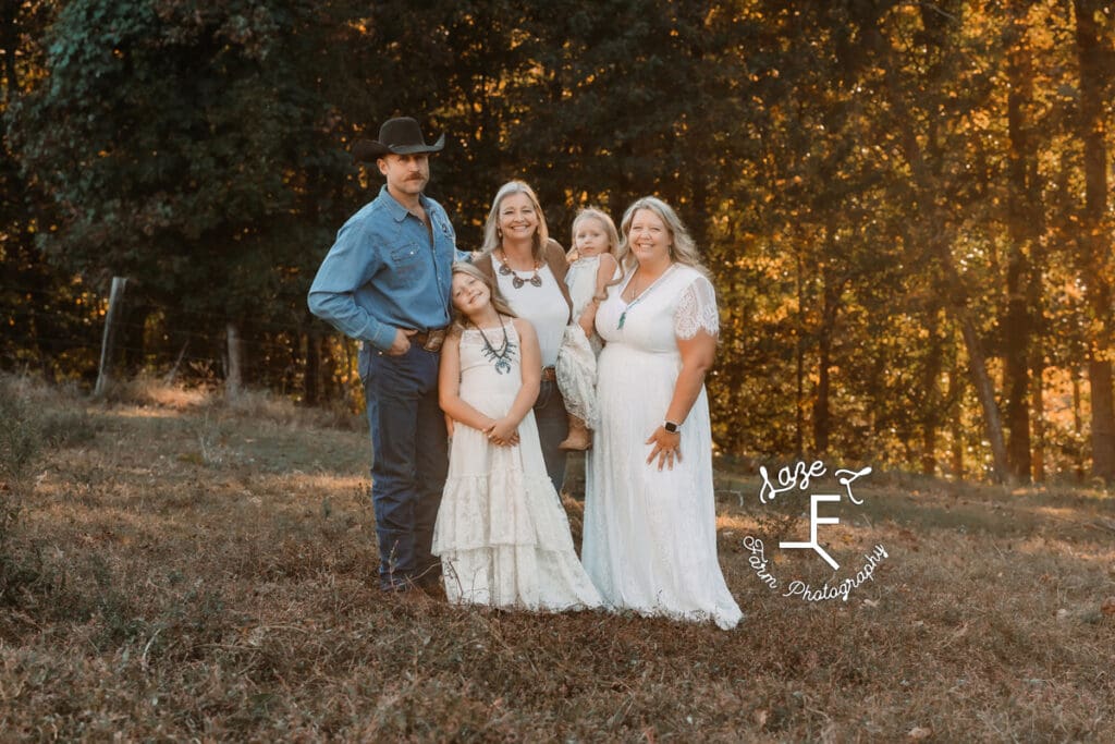 Grandmother, mom, dad and girls standing together