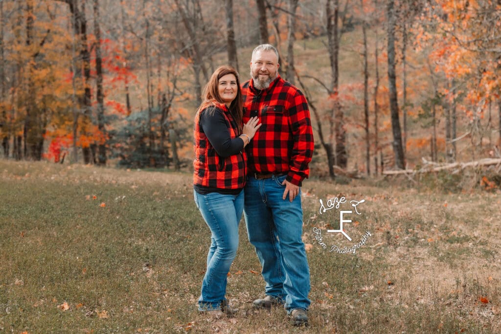 Mom and Dad standing together in field