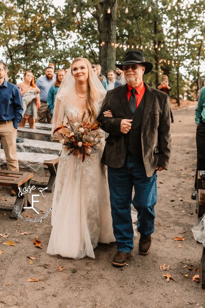 Bride and dad walking down the aisle