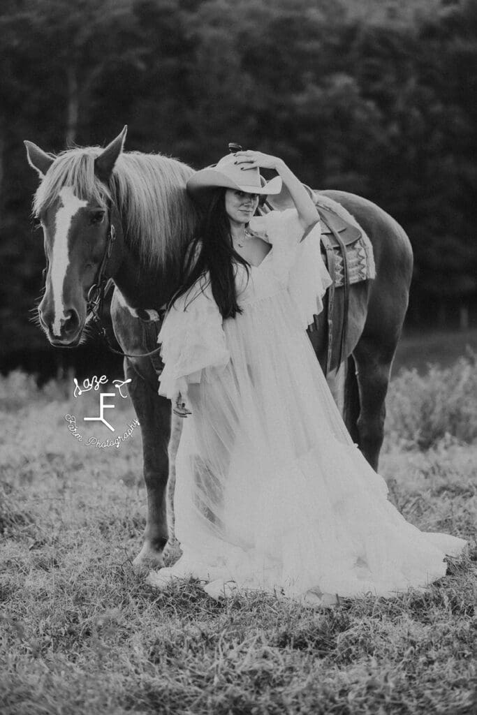 Sam in white flowy dress with Gus in black and white