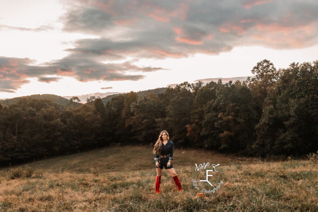 Wendy in red fringe boots and denim jumper at sunset