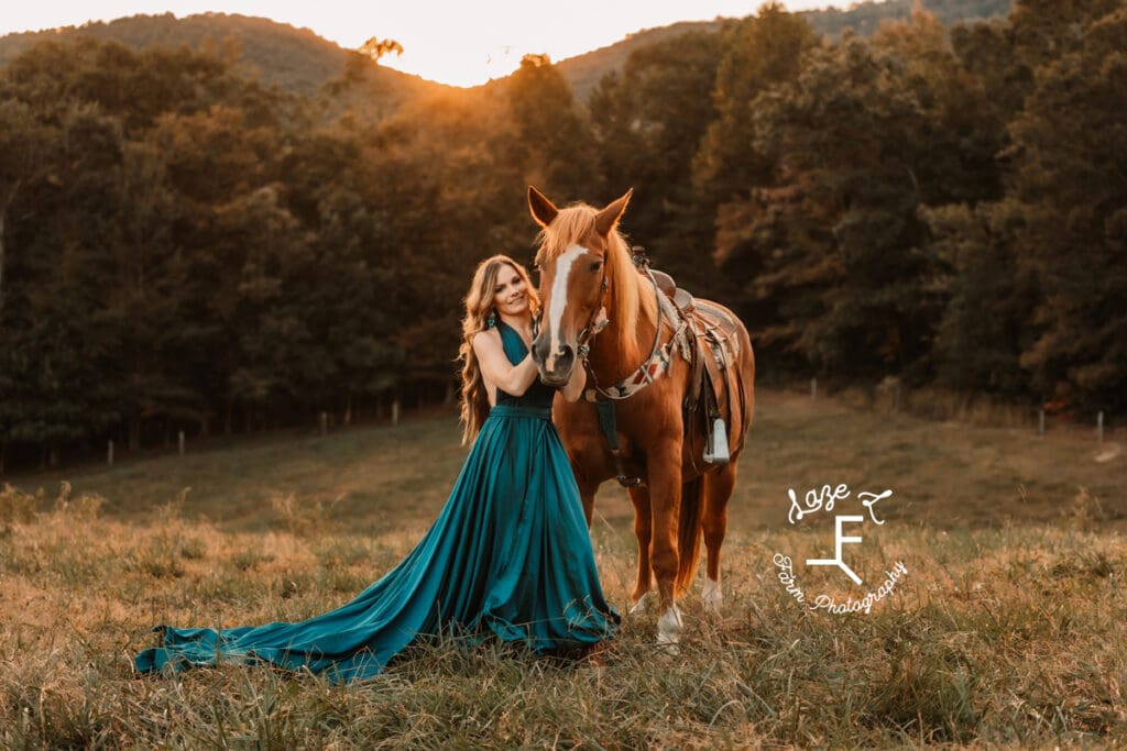 Wendy standing with Gus at sunset