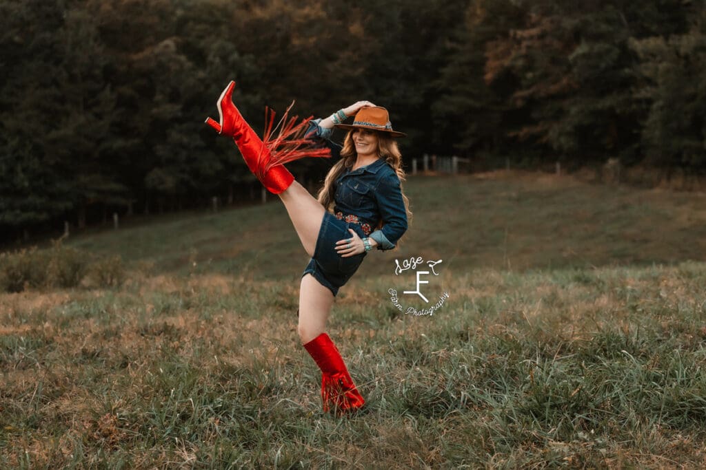 Wendy wearing red fringe boots kicking up