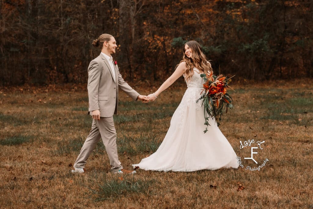 bride and groom walking looking at each other