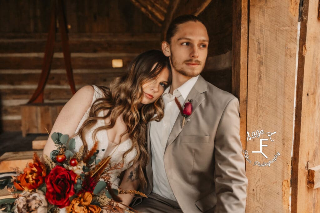 Bride and groom standing at door of ceremony space