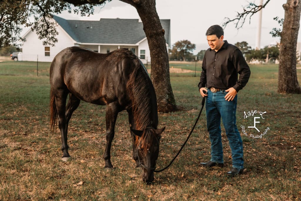 husband with black horse