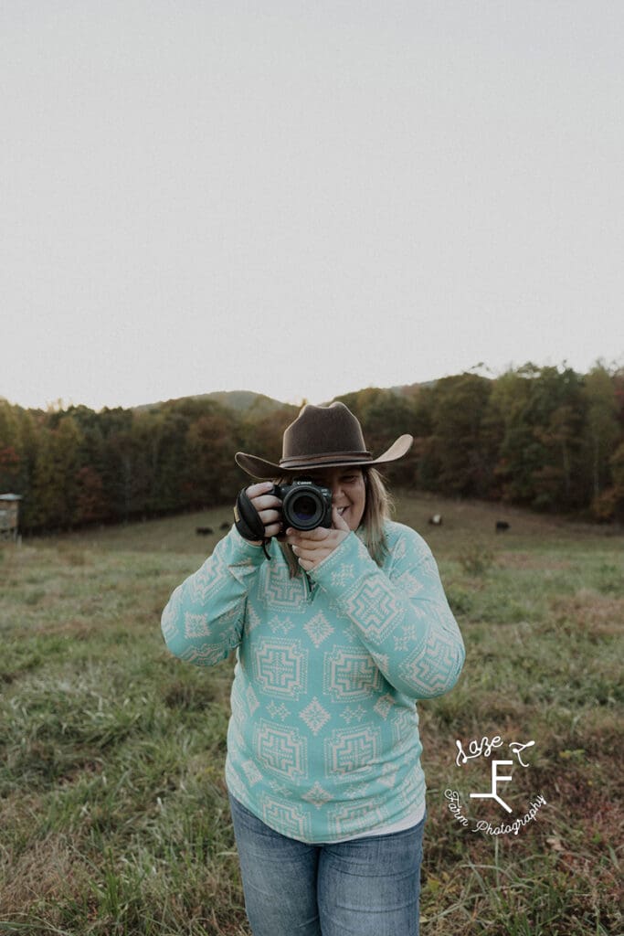 Sarah holding camera to take a picture close up