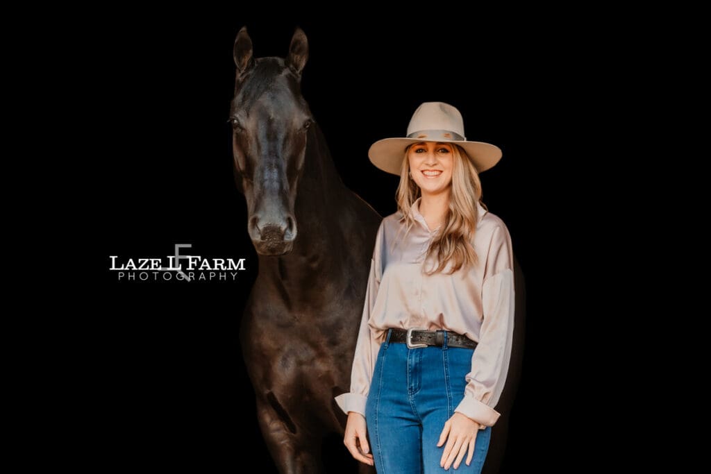 black background of a horse and their owner
