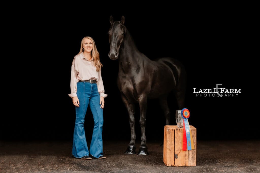 black background of a horse and its owner