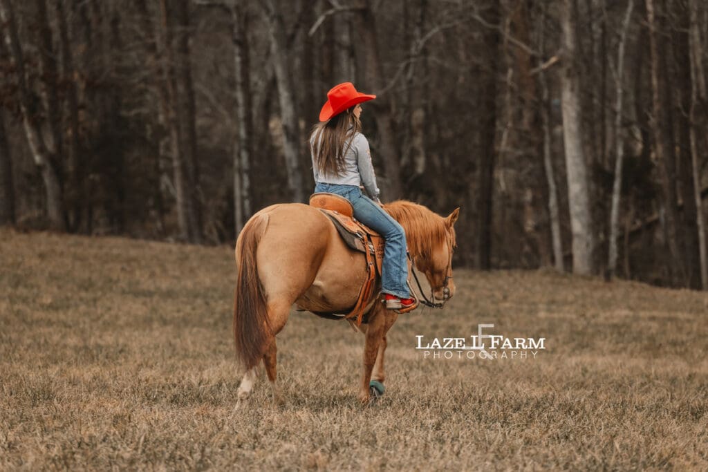cowgirl riding her horse