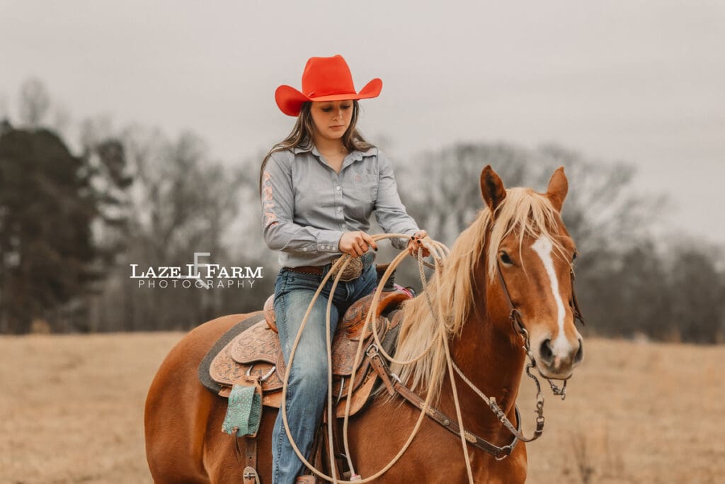 cowgirl riding her horse
