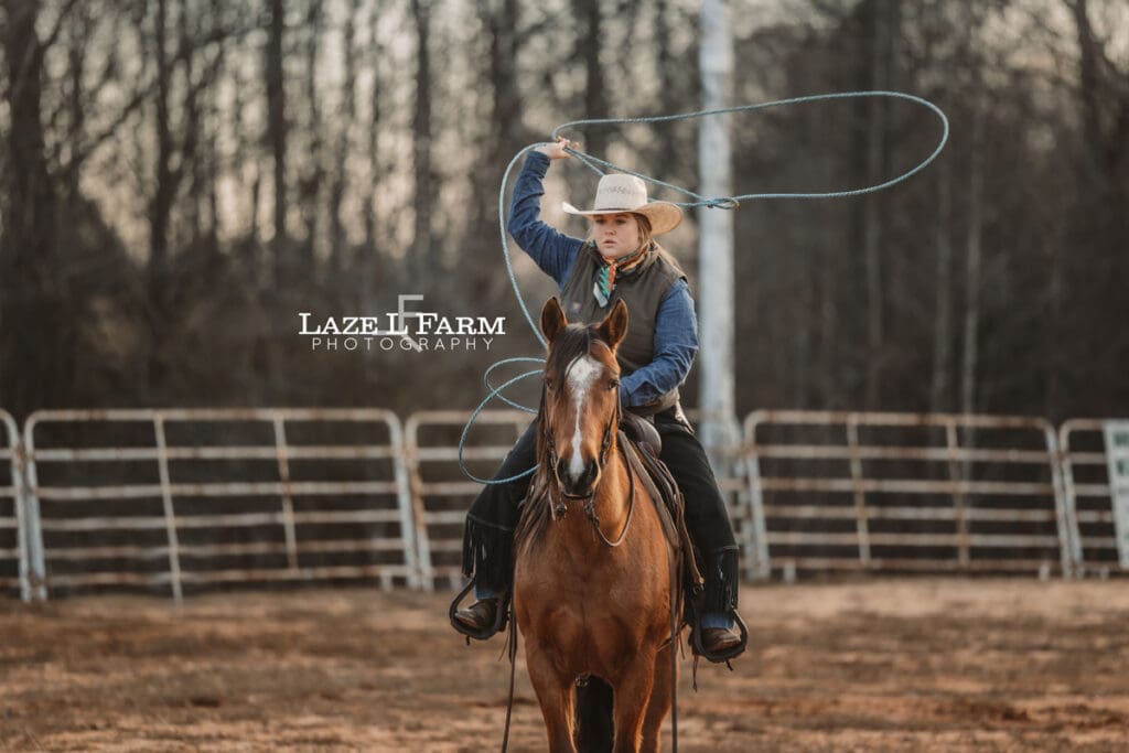 cowgirl swinging a rope
