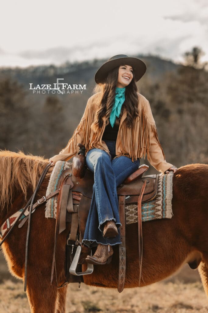 cowgirl sitting sideways in the saddle