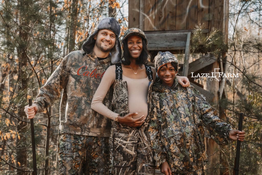 family in front of the deer stand