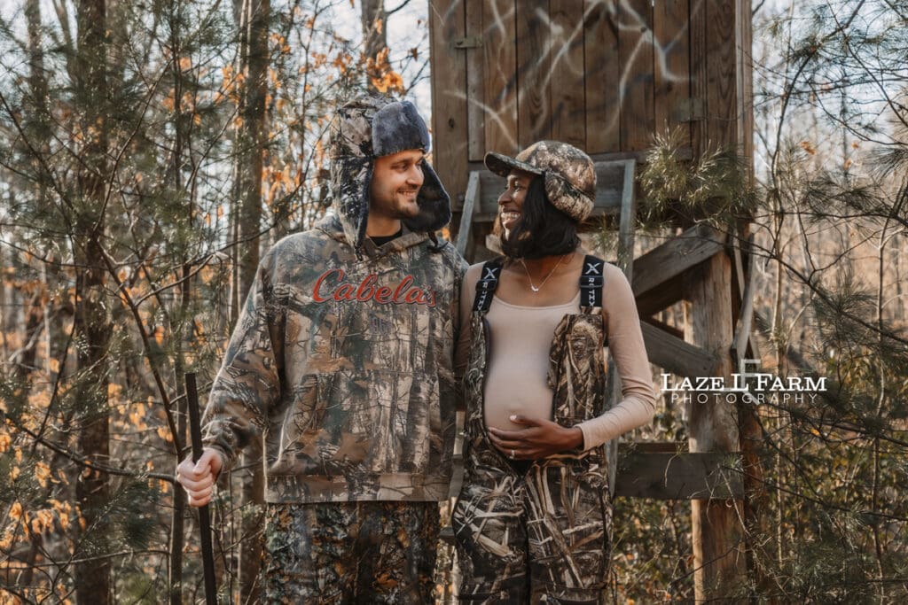 family in front of the deer stand