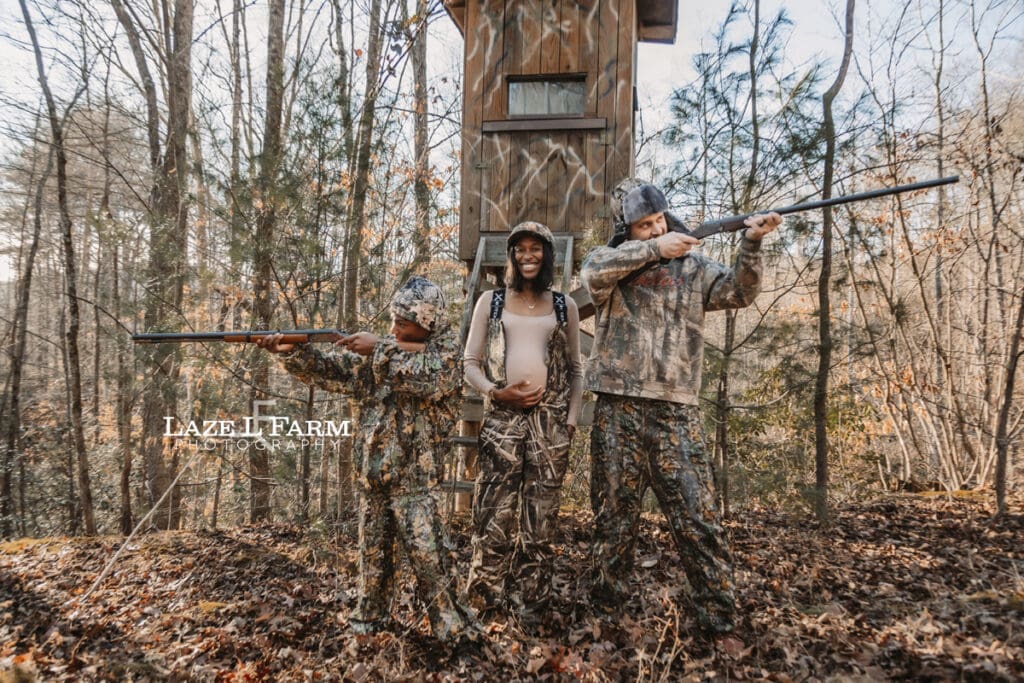 family in front of the deer stand