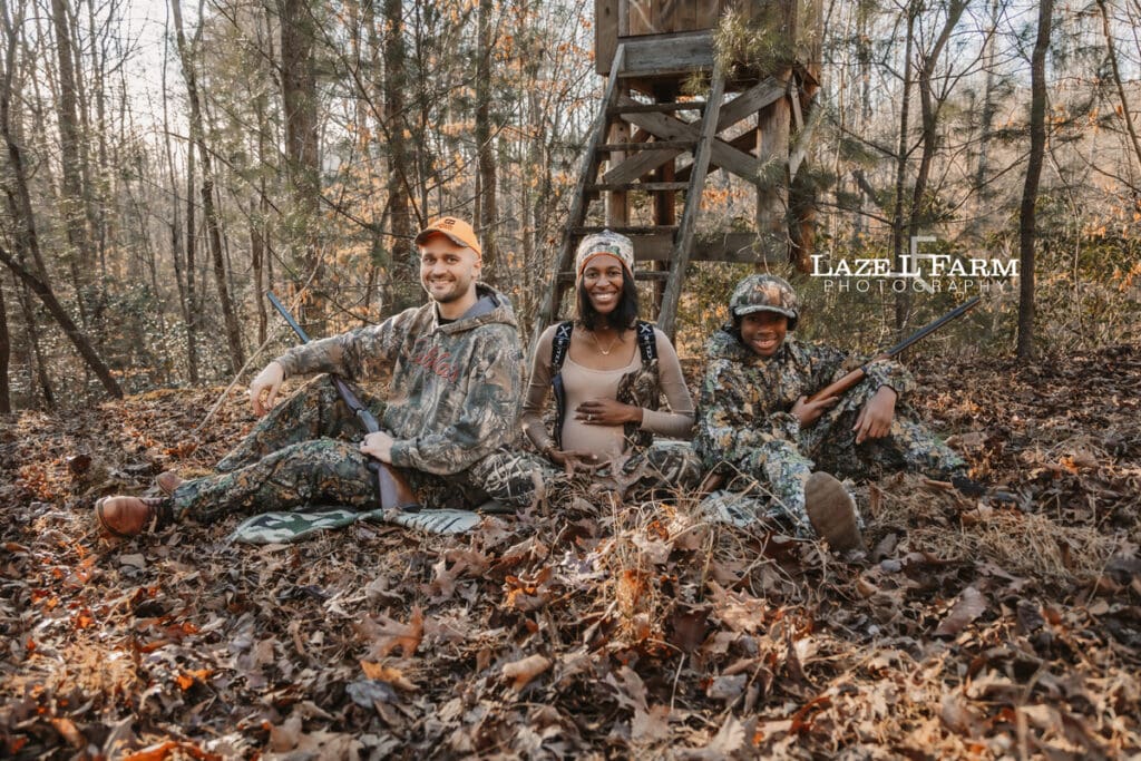 family in front of the deer stand