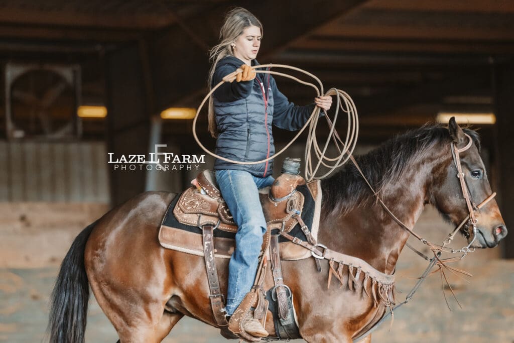 cowgirl coiling her rope