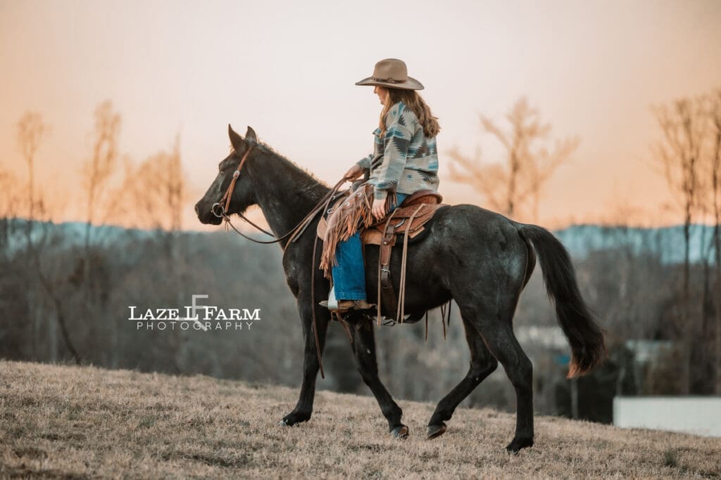 cowgirl riding her horse