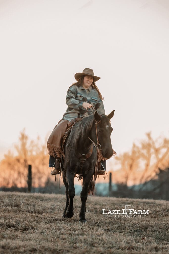 cowgirl riding her horse