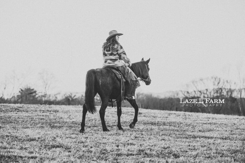 cowgirl riding her horse