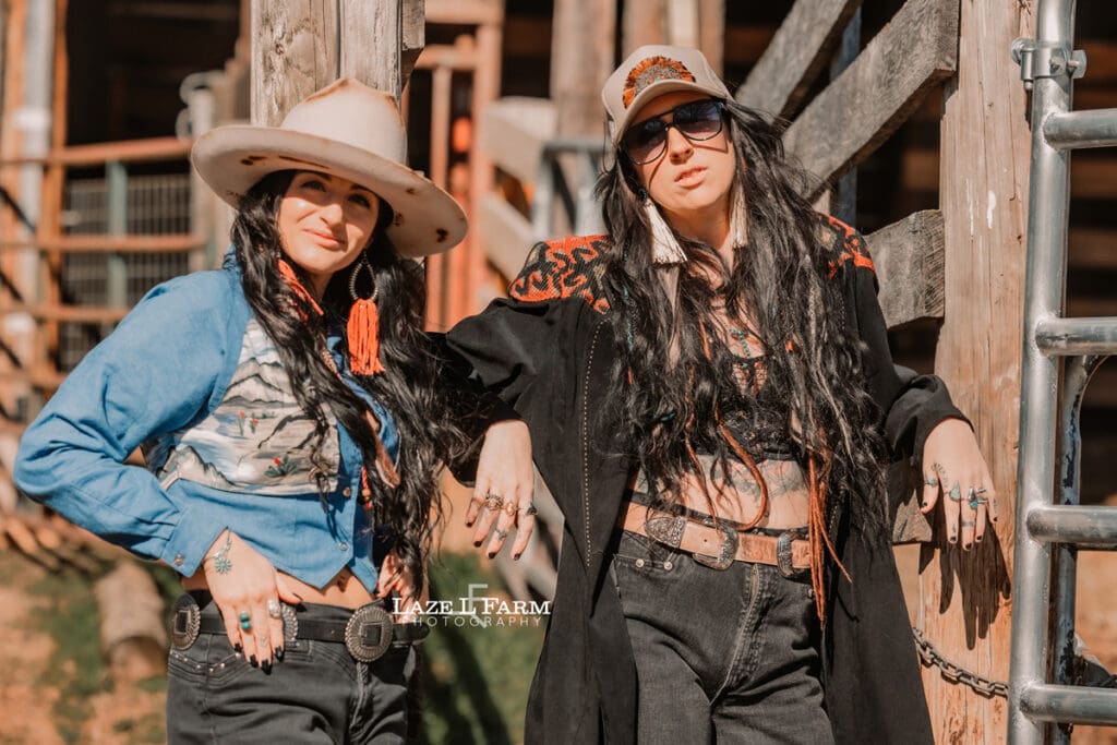 cowgirls leaning against cattle shoot
