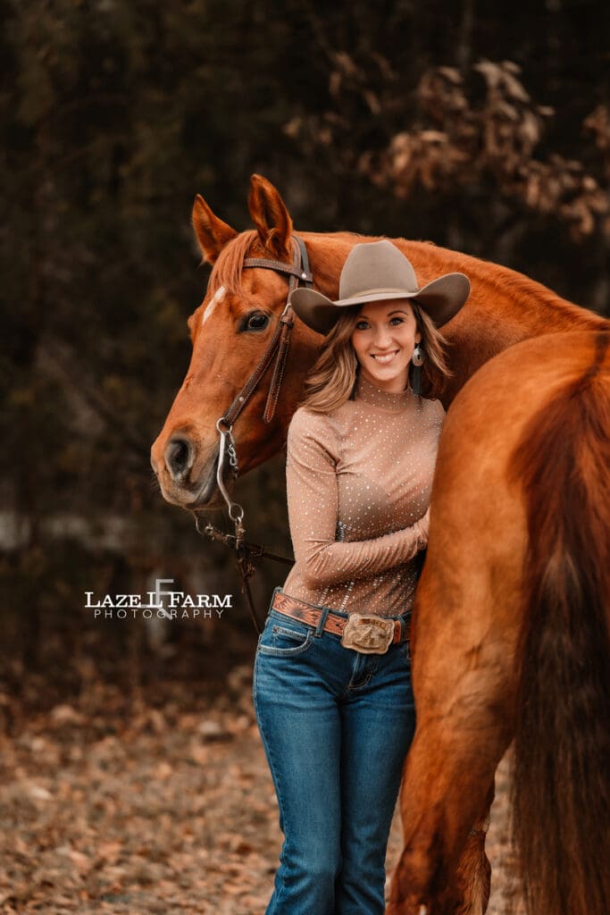 cowgirl hugging her horse