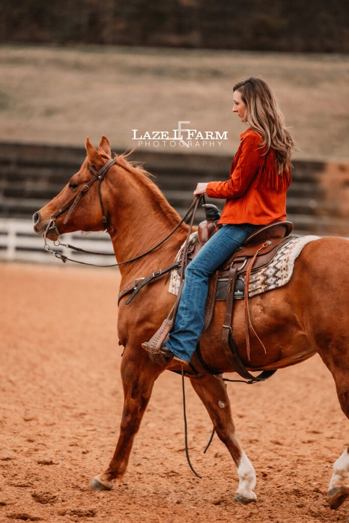 cowgirl riding her horse