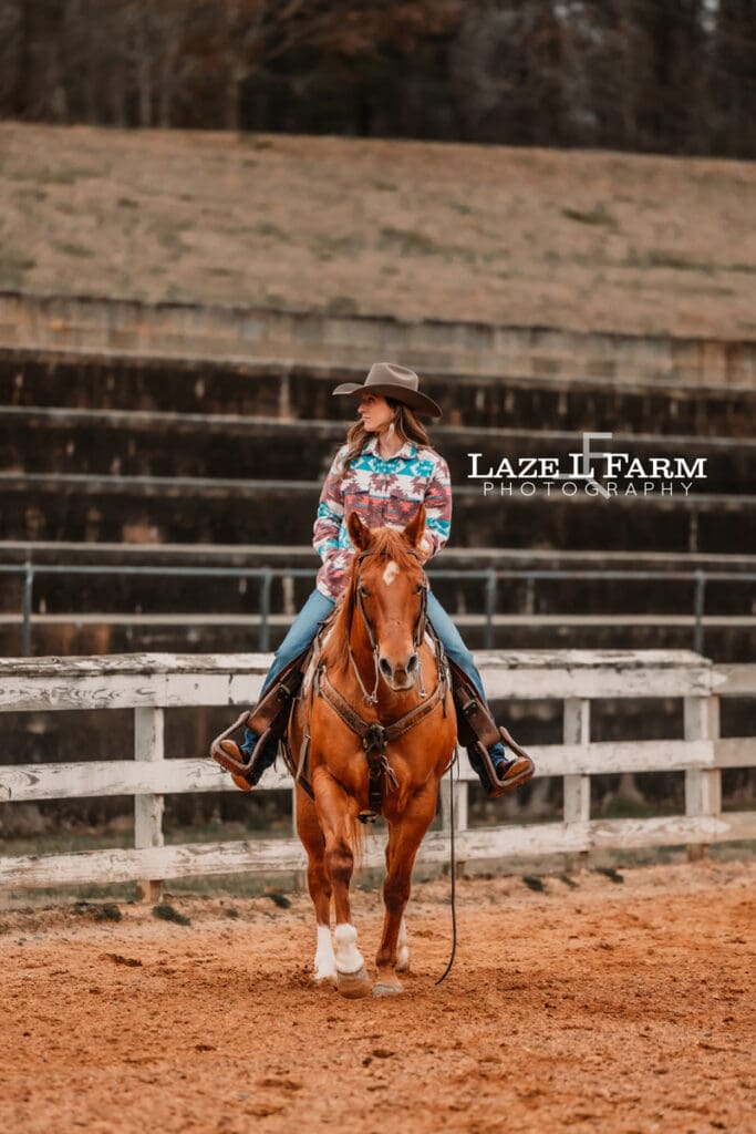 cowgirl walking on her horse