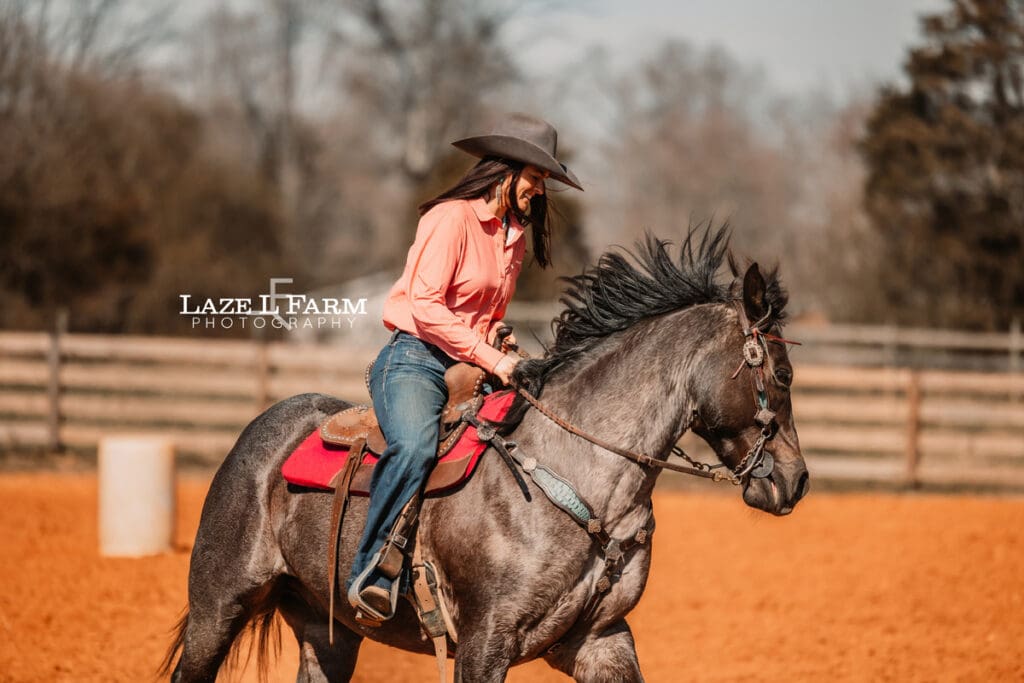 cowgirl riding her horse