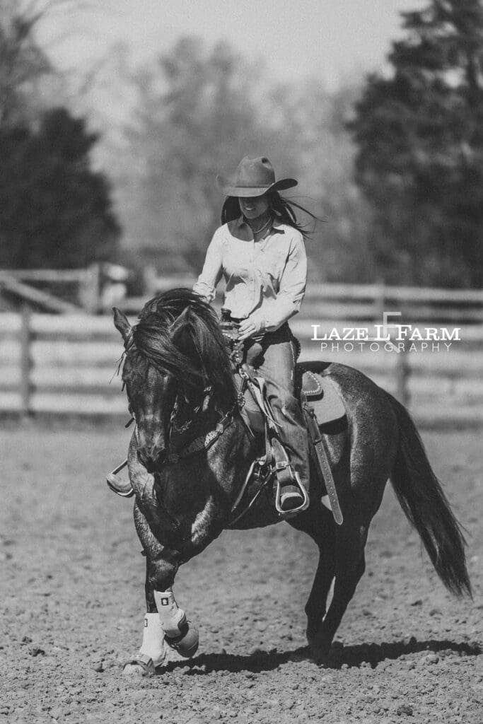 cowgirl riding her horse
