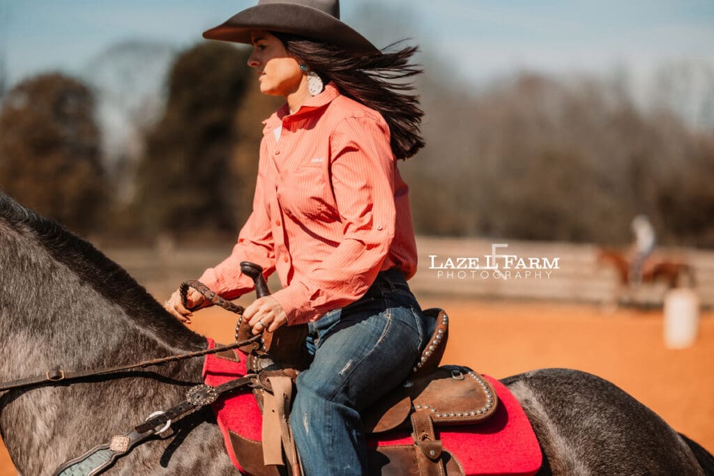 cowgirl riding her horse