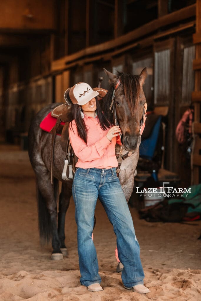 cowgirl hugging her horse