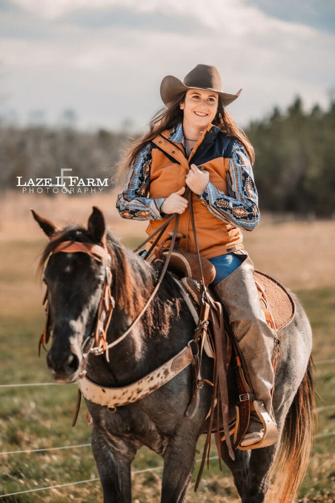 cowgirl riding her horse