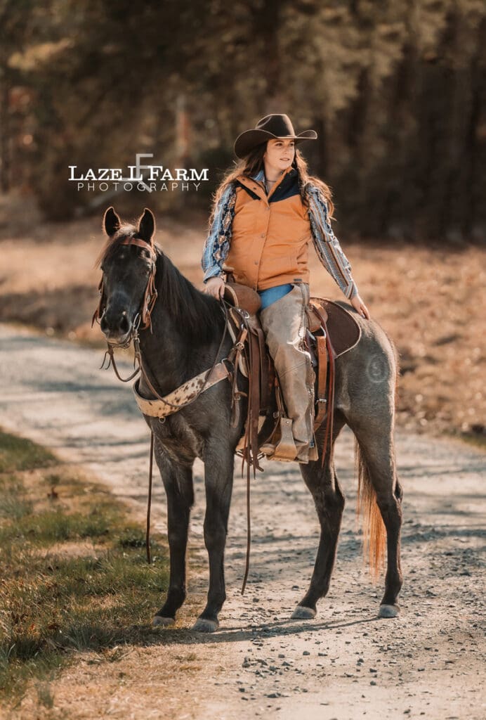 cowgirl riding her horse