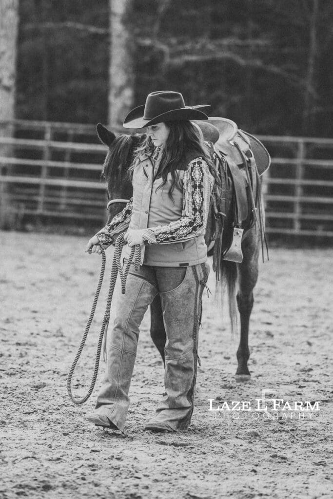 cowgirl leading horse