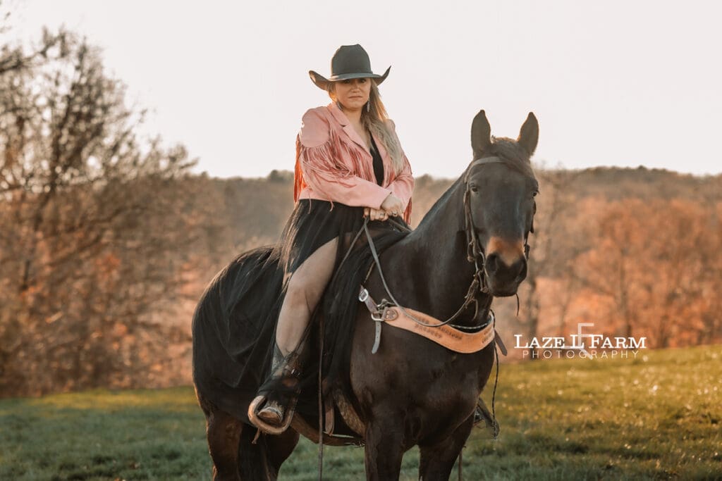 girl in a dress riding a horse